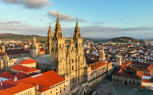 Aerial view of Santiago de Compostela Cathedral with surrounding cityscape.