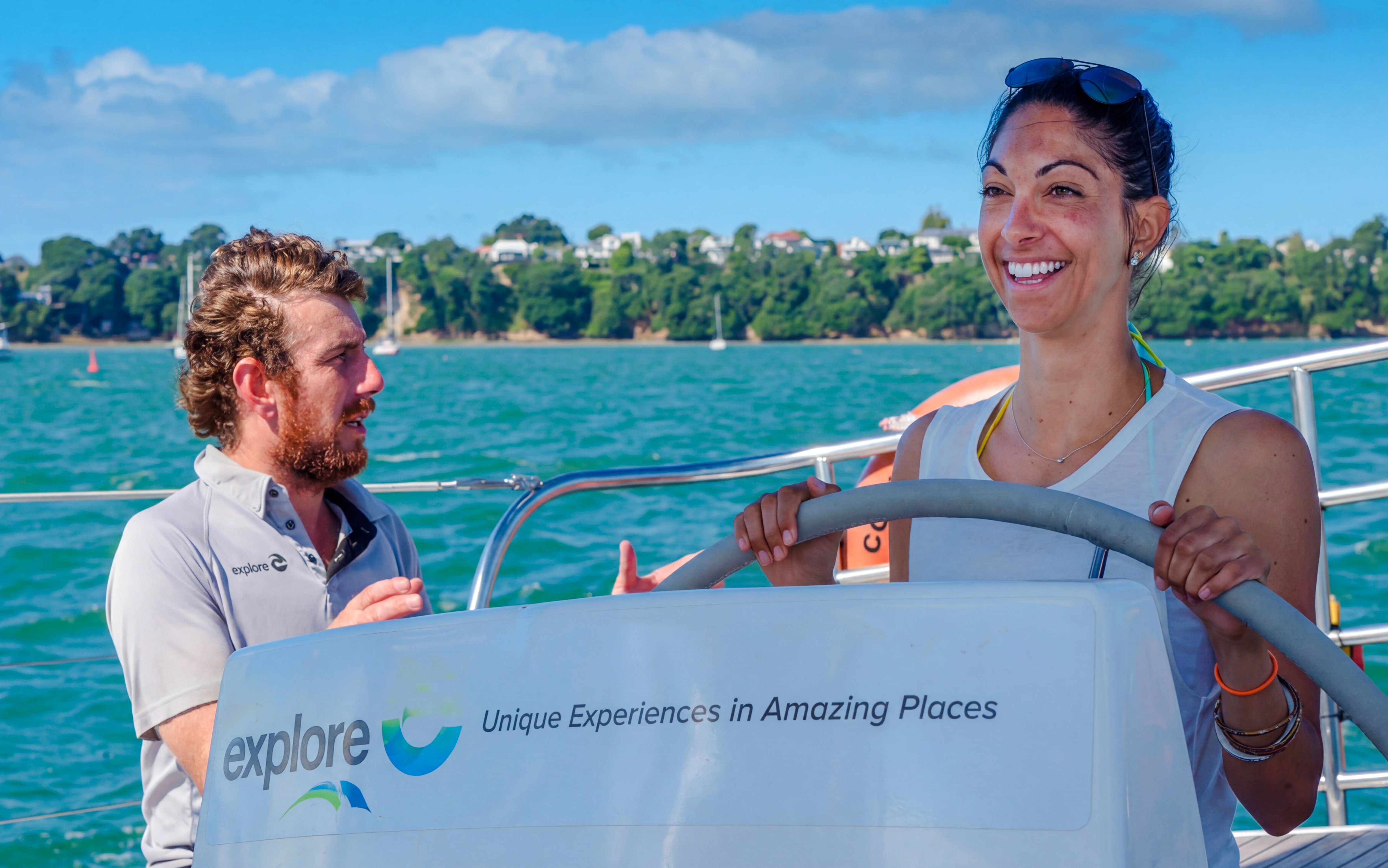 Sailing cruise on Waitematā Harbour, Auckland with smiling participants.