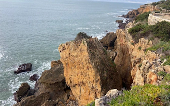 Rocky cliffs along the coastline in Cascais, Portugal, ideal for rock climbing tours.