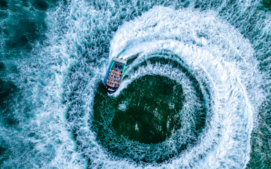 Jet boat spinning 360 degrees on the Gold Coast water.