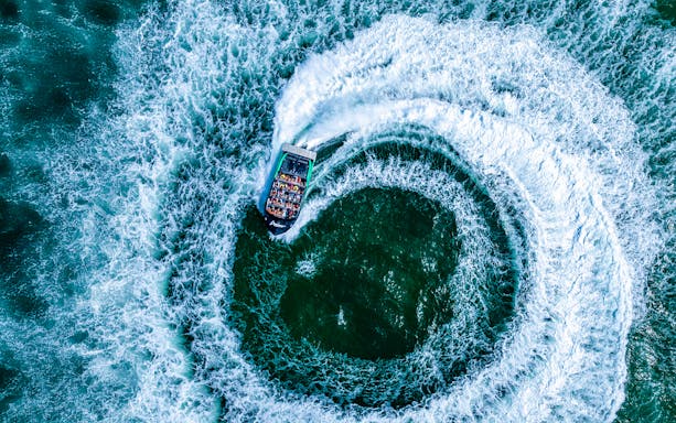 Jet boat spinning 360 degrees on the Gold Coast water.