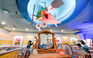 Colorful airplane model and vintage decor at Mickey's Toontown, Disneyland Park, California.