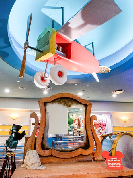 Colorful airplane model and vintage decor at Mickey's Toontown, Disneyland Park, California.