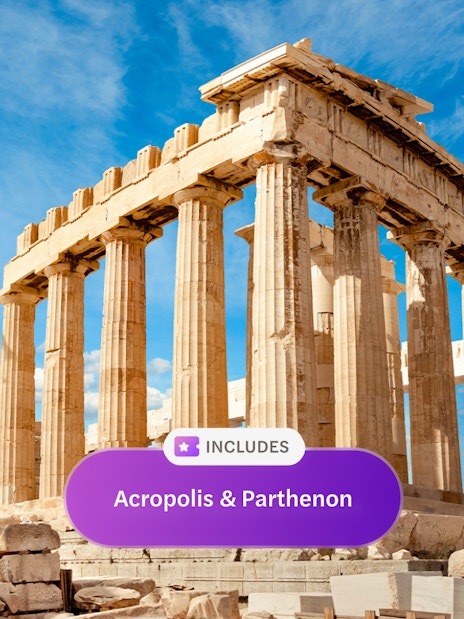 Parthenon temple on Acropolis hill under blue sky in Athens, Greece.