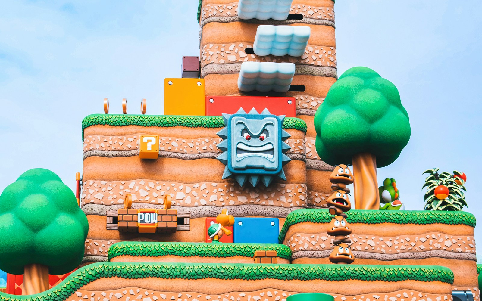 Super Nintendo World themed landscape with iconic game elements at Universal Studios.