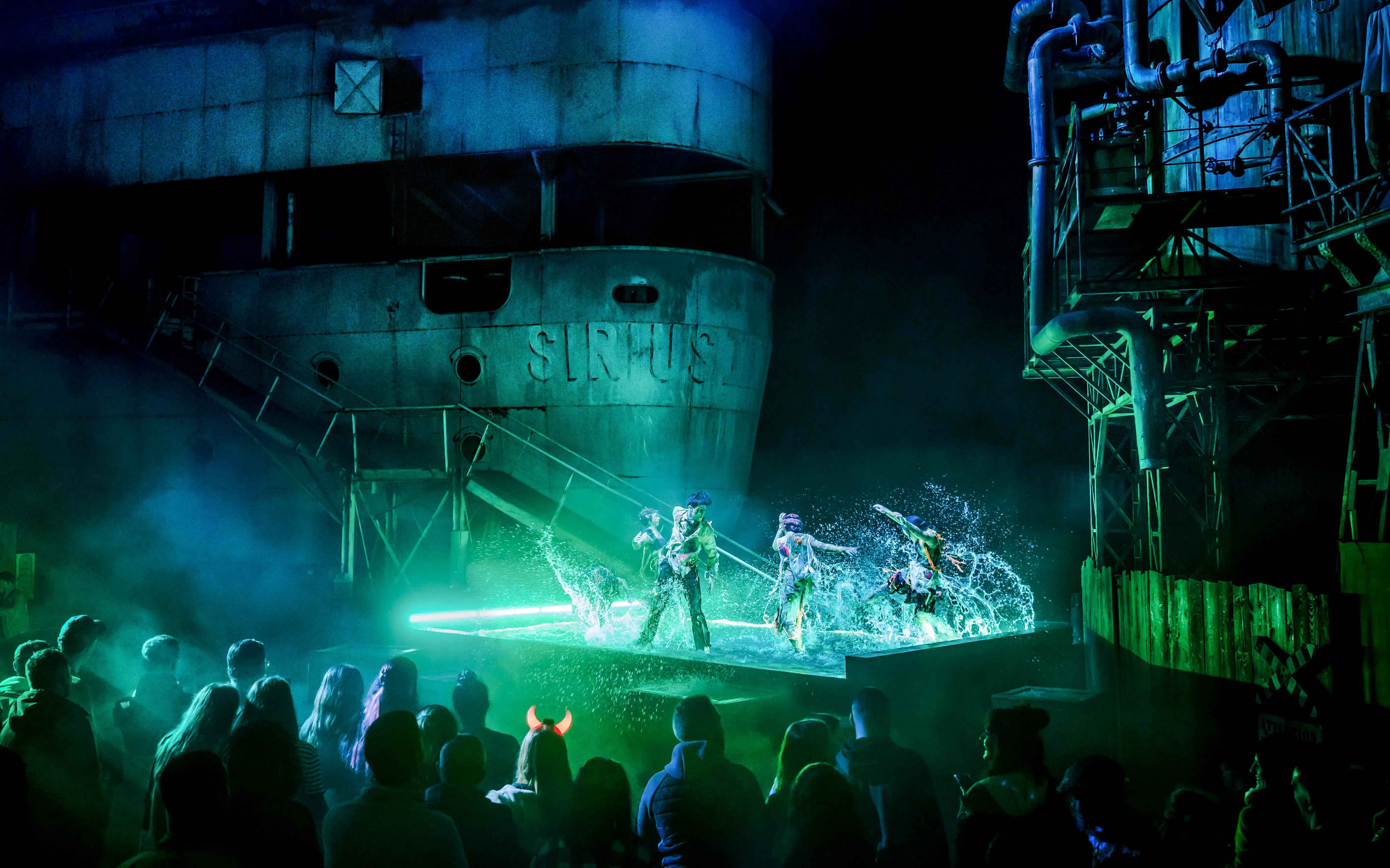 Performers in a water show at Parc Asterix Halloween event, Paris, France.