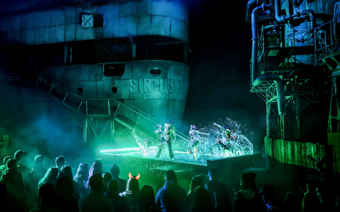 Performers in a water show at Parc Asterix Halloween event, Paris, France.