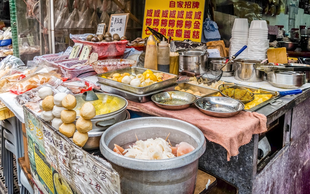 Street food stall with traditional snacks on Lantau Island during Ngong Ping Cable Car Ride tour.
