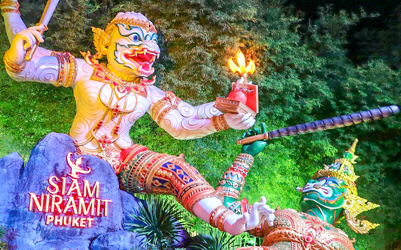 Siam Niramit Phuket show statue with vibrant costumes and traditional Thai art.