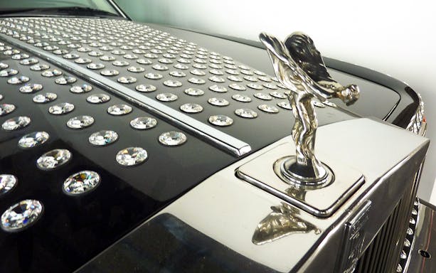 Luxury car hood with crystal embellishments at Malaga Automobile & Fashion Museum.