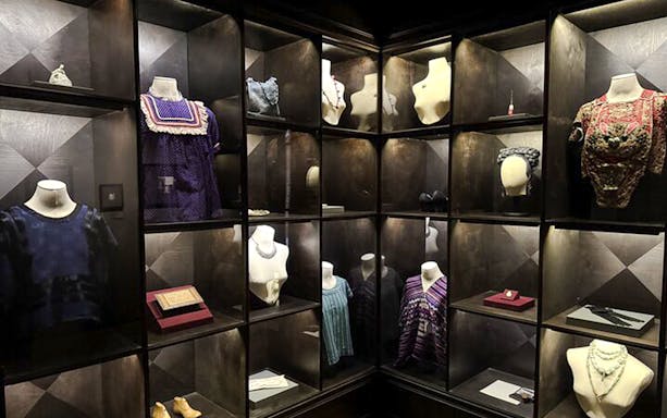 Frida Kahlo Museum display of traditional clothing and accessories in Mexico City.