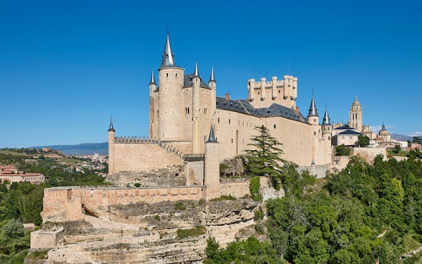 Segovia Alcazar fortress with cathedral in medieval town, Spain.