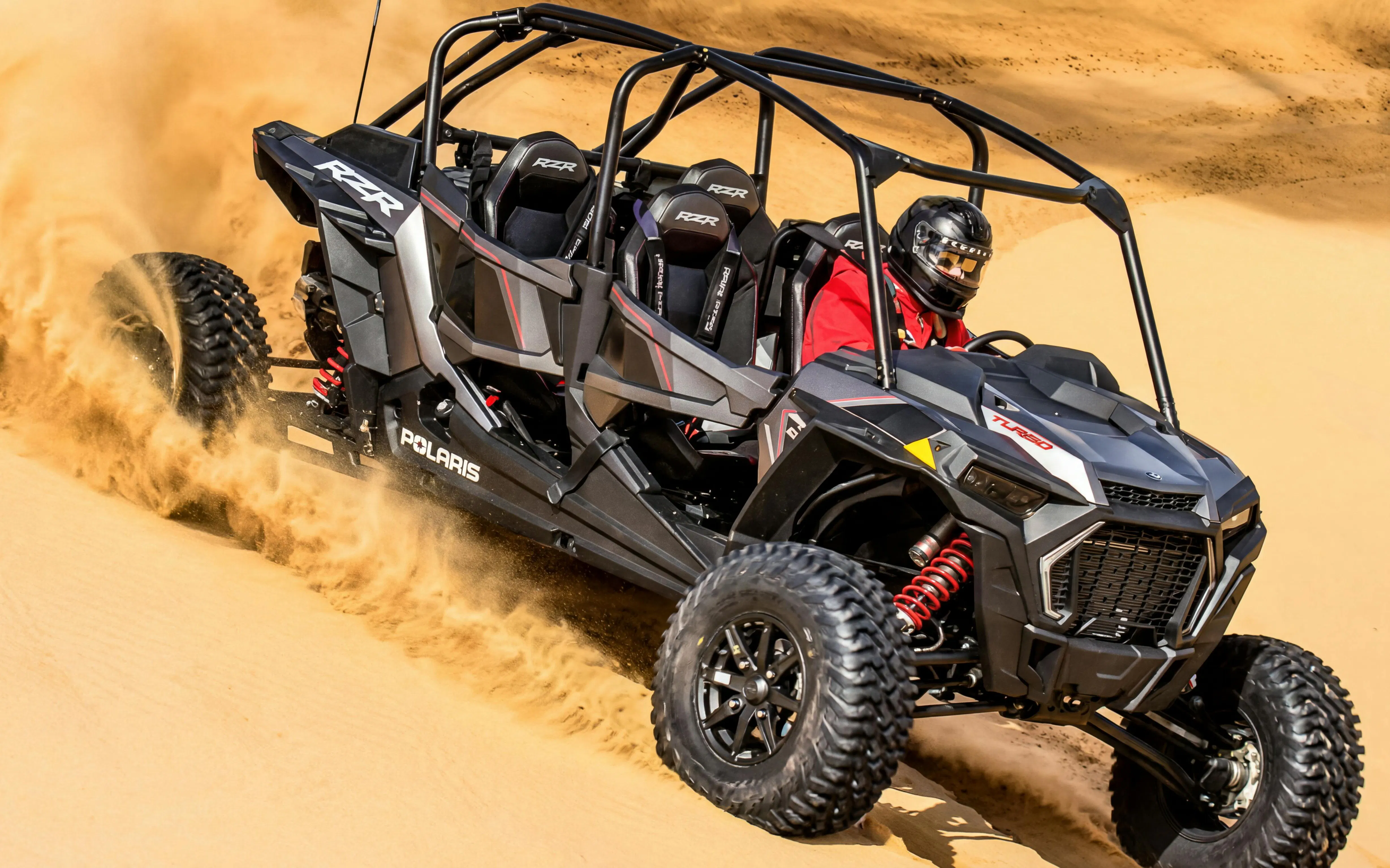Desert buggy navigating sand dunes on a 4-seater safari adventure.