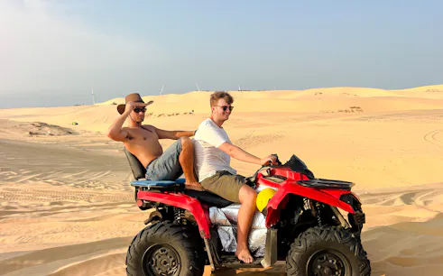 ATV ride through sand dunes on Mui Ne Jeep Tour, Ho Chi Minh City.