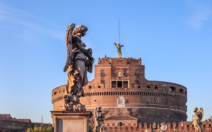 Castel Sant'Angelo with angel statue in foreground, Rome, Italy.