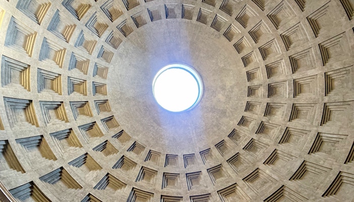 Oculus view inside Roman Pantheon, Rome, Italy, showcasing architectural design.