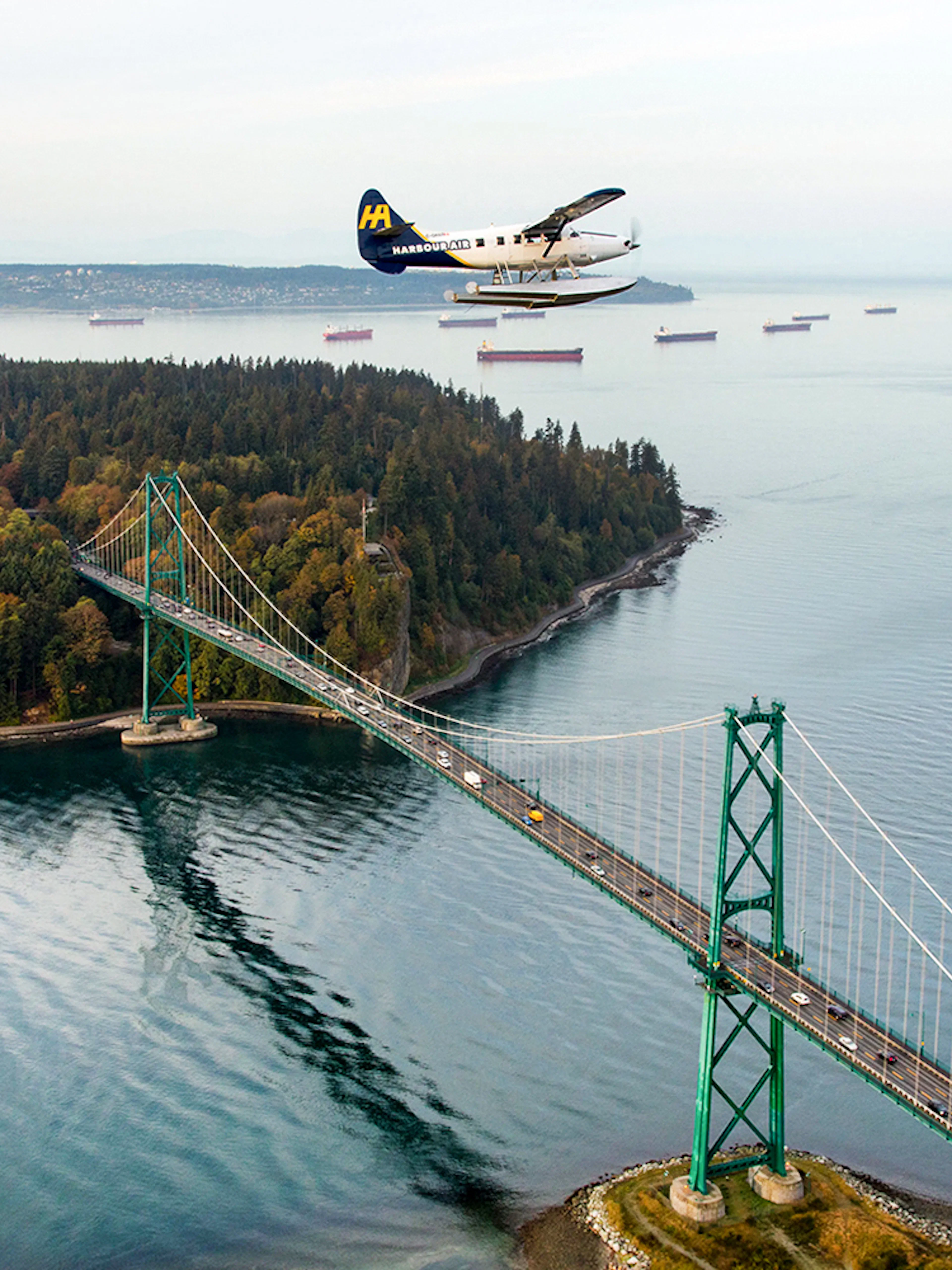 Seaplane flying over Lions Gate Bridge during Vancouver Panorama Scenic Seaplane Tour.