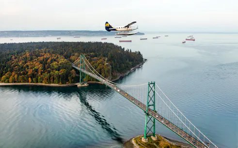 Seaplane flying over Lions Gate Bridge during Vancouver Panorama Scenic Seaplane Tour.