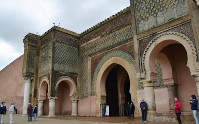 Bab Mansour Gate in Meknes with intricate tilework and arches.