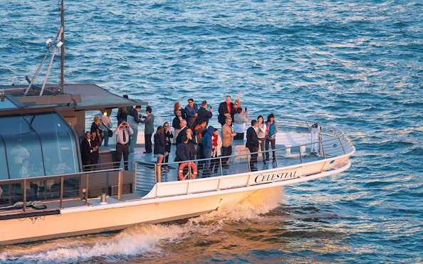 Guests enjoying views on Bateaux New York Premier Dinner Cruise.