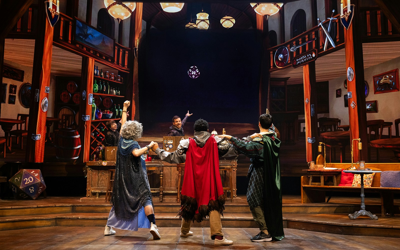 Participants in fantasy costumes engage in a Dungeons & Dragons: The Twenty-Sided Tavern performance.