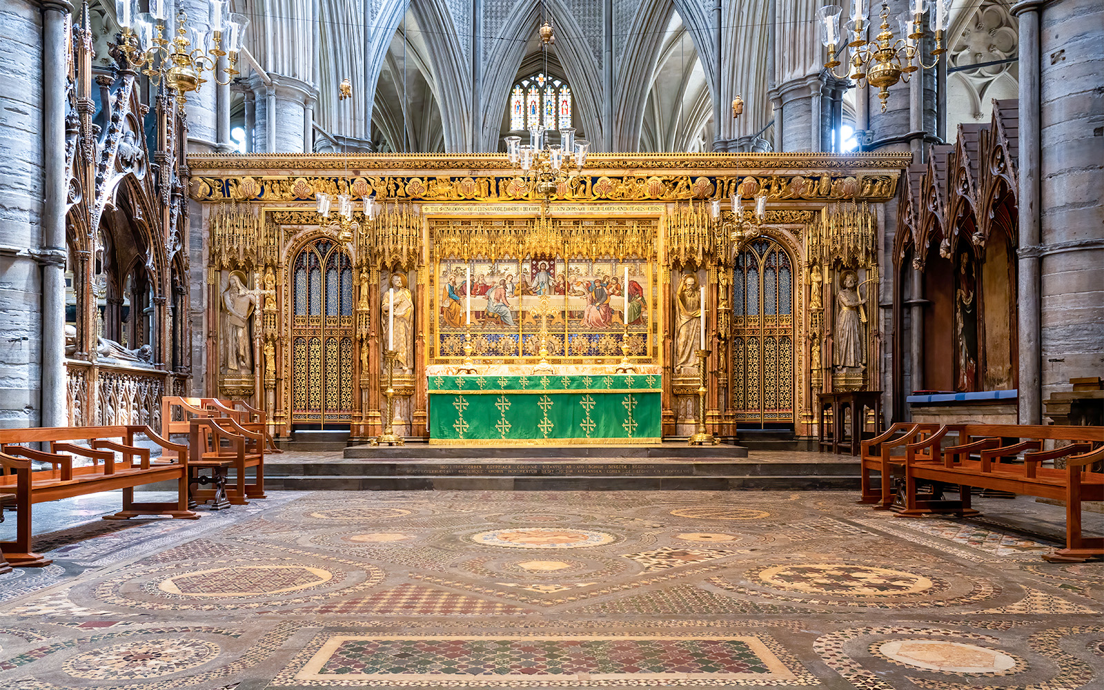 High Altar at Westminster Abbey with ornate gold detailing and religious artwork.