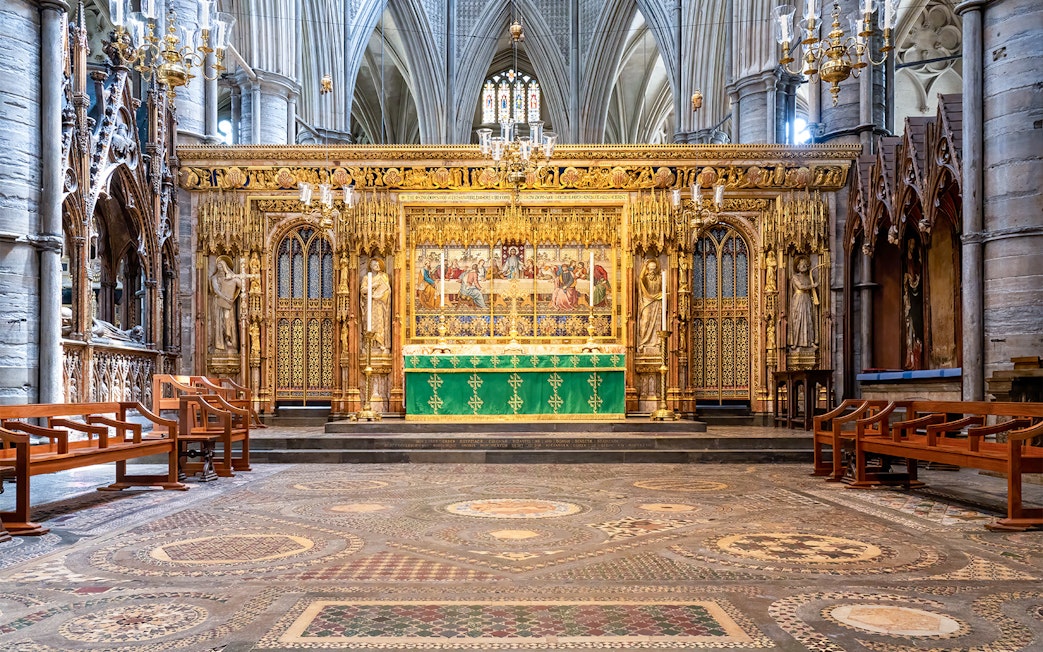 High Altar at Westminster Abbey with ornate gold detailing and religious artwork.