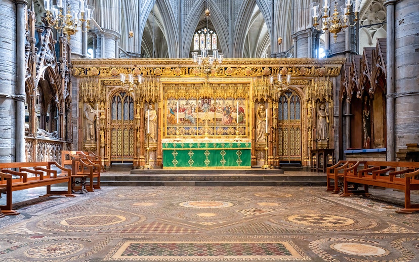 High Altar at Westminster Abbey with ornate gold detailing and religious artwork.