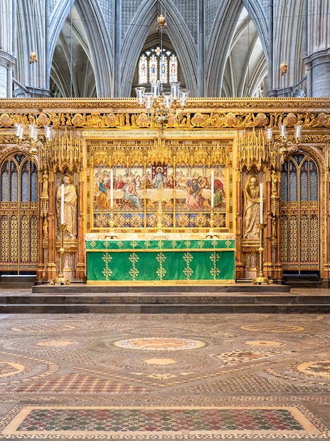 High Altar at Westminster Abbey with ornate gold detailing and religious artwork.