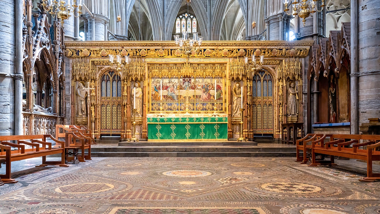 High Altar at Westminster Abbey with ornate gold detailing and religious artwork.