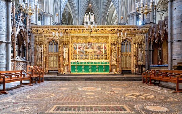 High Altar at Westminster Abbey with ornate gold detailing and religious artwork.
