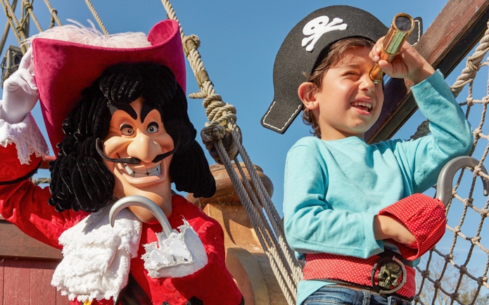 Child dressed as pirate with Captain Hook at Disneyland Paris.