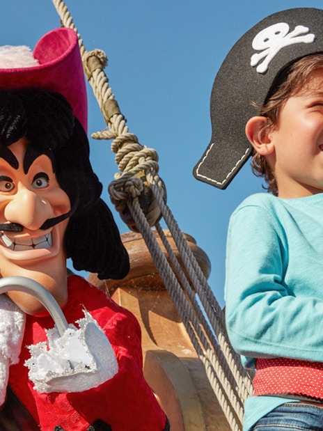 Child dressed as pirate with Captain Hook at Disneyland Paris.