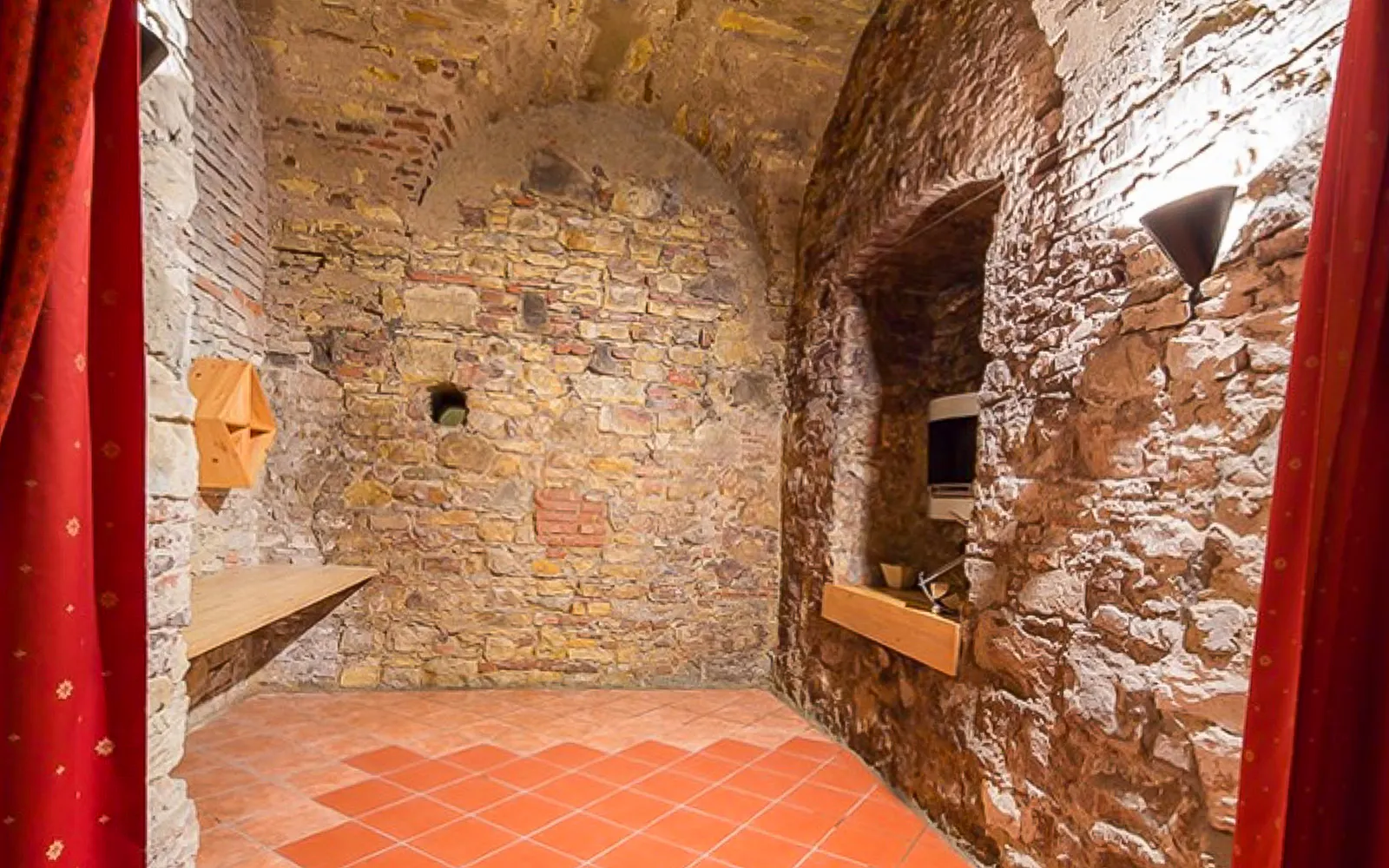 Inside stone-walled room of Minorite monastery of St James, Prague.