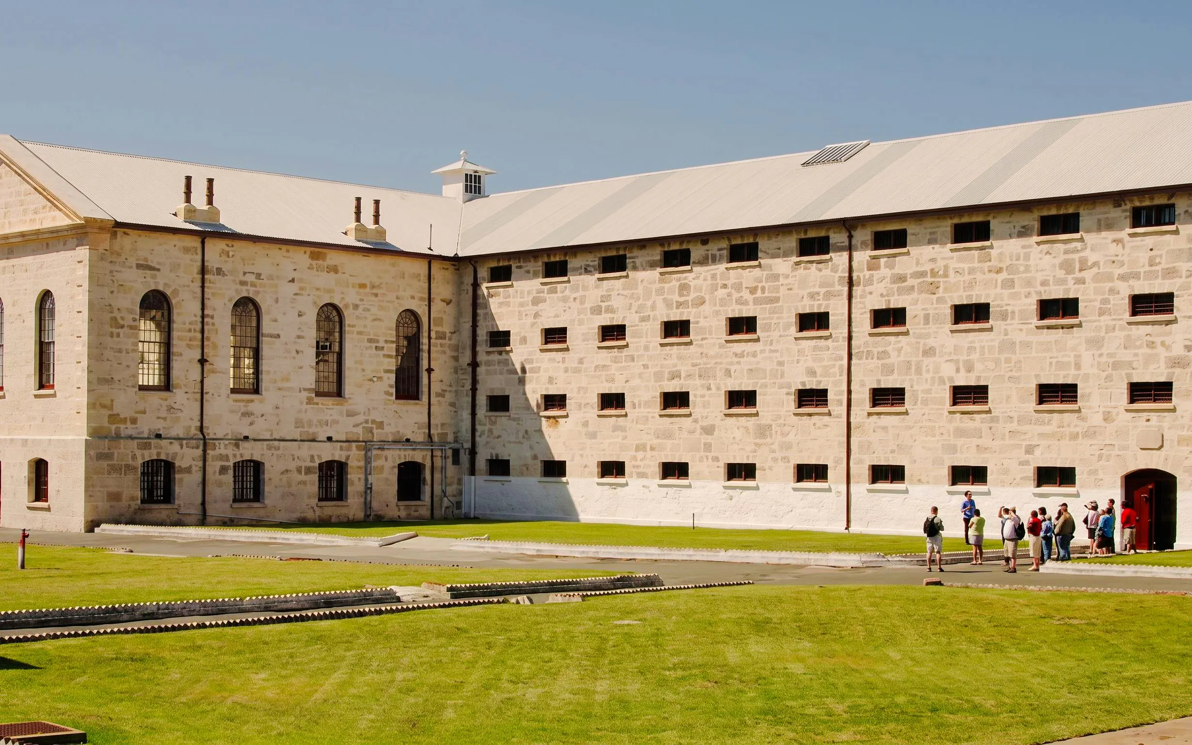 Tourists gather at the entrance of Fremantle Prison in Australia.