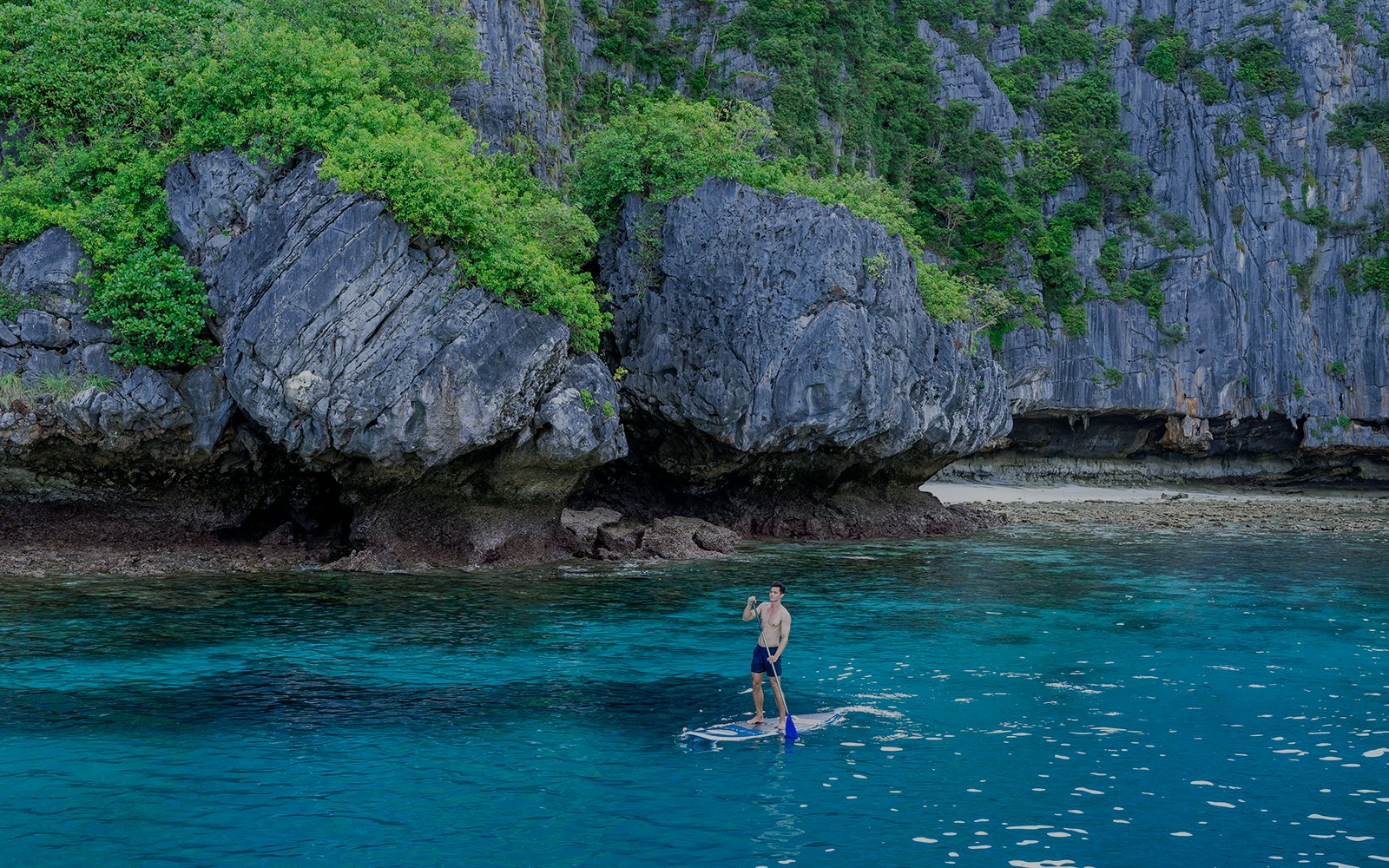 A man on a paddleboat - Phi Phi Islands