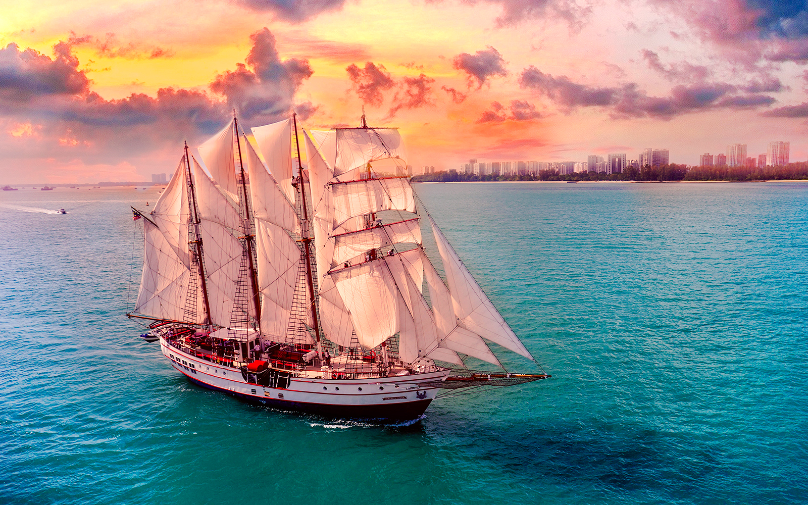 Sailing ship on ocean during sunset, Royal Albatross Dinner Cruise.