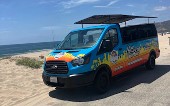 Open-air tour van on Santa Monica beach, part of the Santa Monica to Malibu tour.