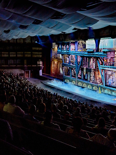 Audience watching a historical performance at Puy du Fou España theater.