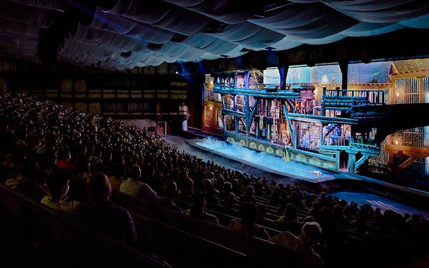 Audience watching a historical performance at Puy du Fou España theater.