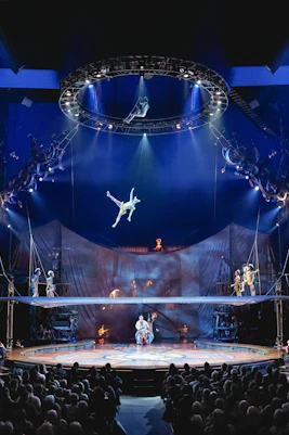 Acrobat performing mid-air at Cirque du Soleil: Kurios show in London.
