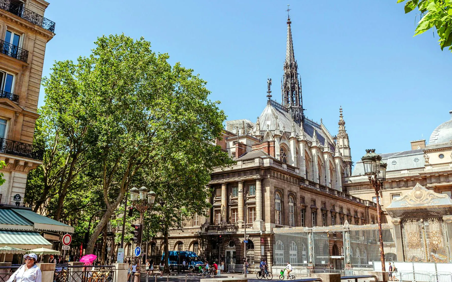 Sainte-Chapelle exterior with spire and Gothic architecture on a sunny day in Paris.
