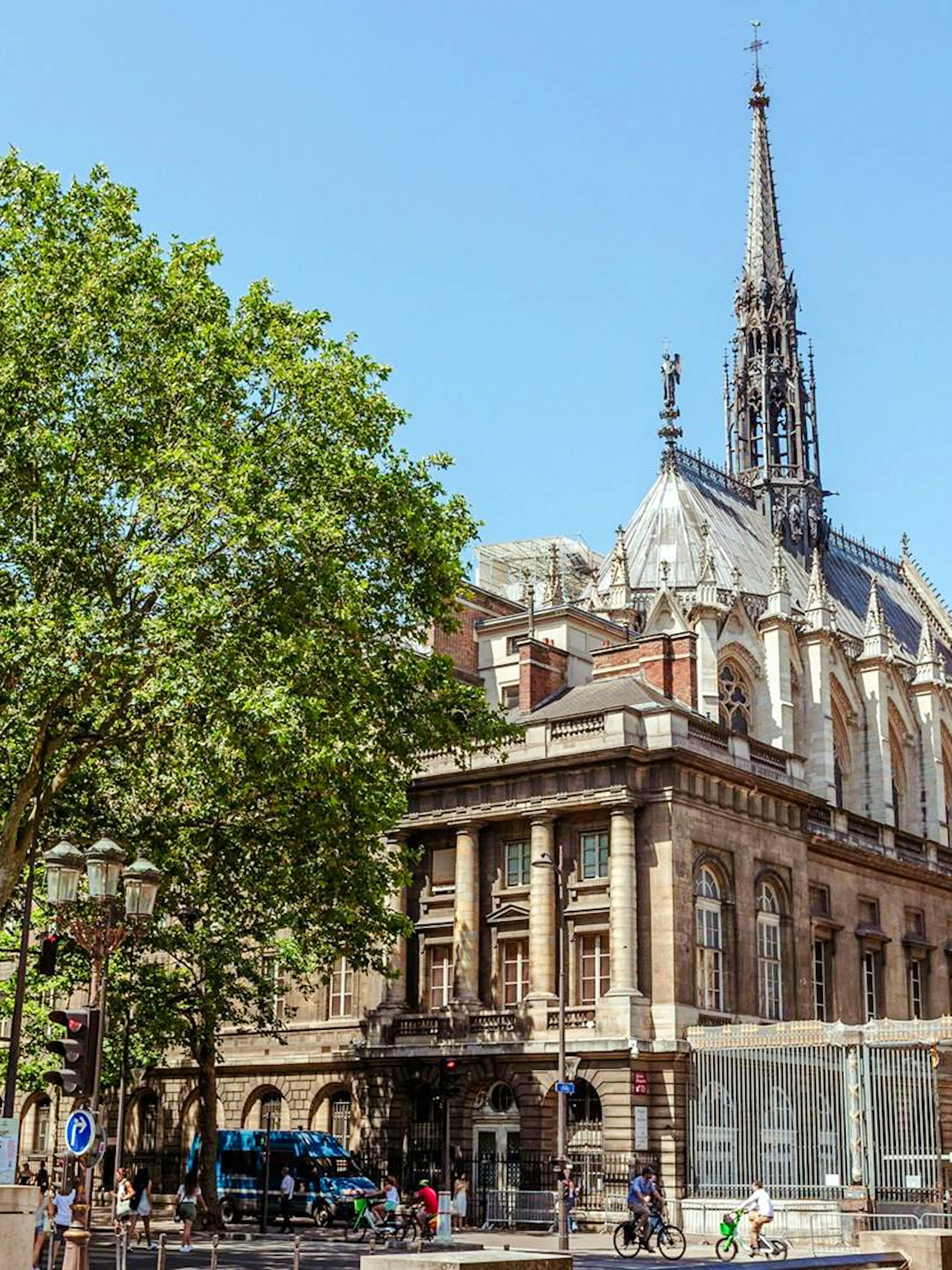 Sainte-Chapelle exterior with spire and Gothic architecture on a sunny day in Paris.
