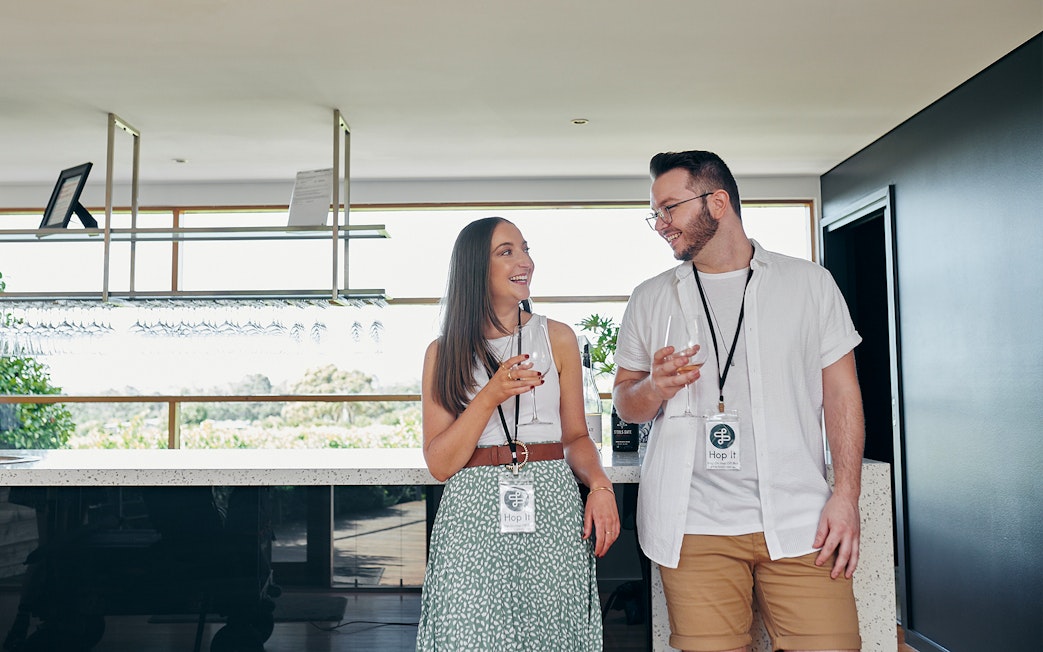Visitors enjoying wine tasting at a Yarra Valley winery on a hop-on-hop-off tour from Melbourne.