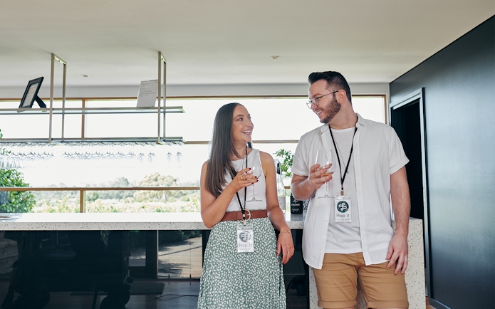 Visitors enjoying wine tasting at a Yarra Valley winery on a hop-on-hop-off tour from Melbourne.