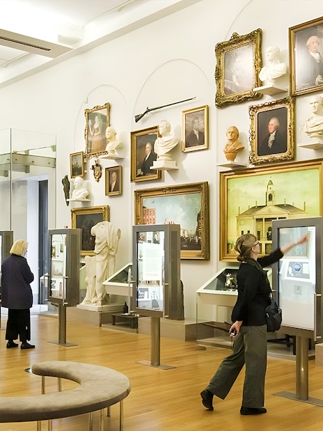 Visitors exploring exhibits at New York Historical Society.