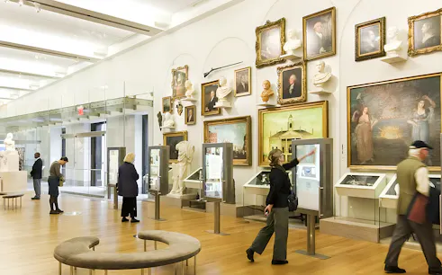 Visitors exploring exhibits at New York Historical Society.