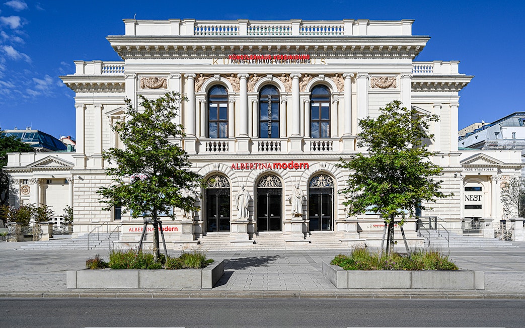 Exterior of ALBERTINA MODERN museum in Vienna with neoclassical architecture.