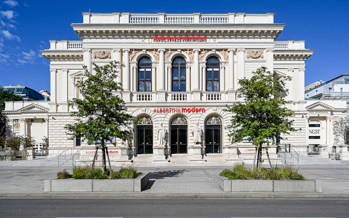 Exterior of ALBERTINA MODERN museum in Vienna with neoclassical architecture.
