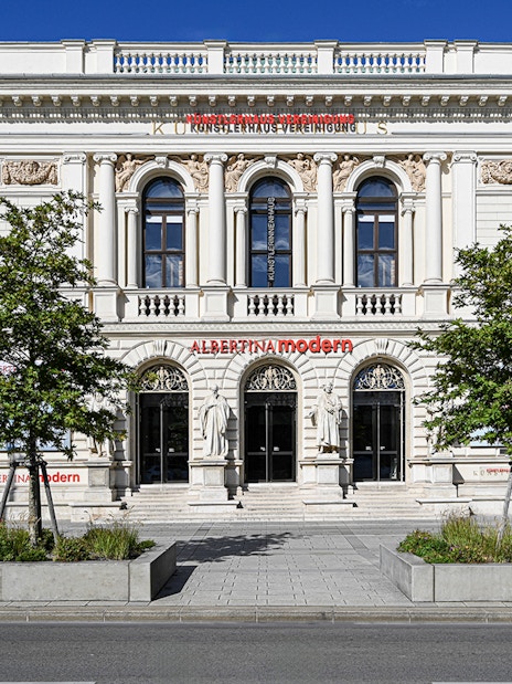 Exterior of ALBERTINA MODERN museum in Vienna with neoclassical architecture.